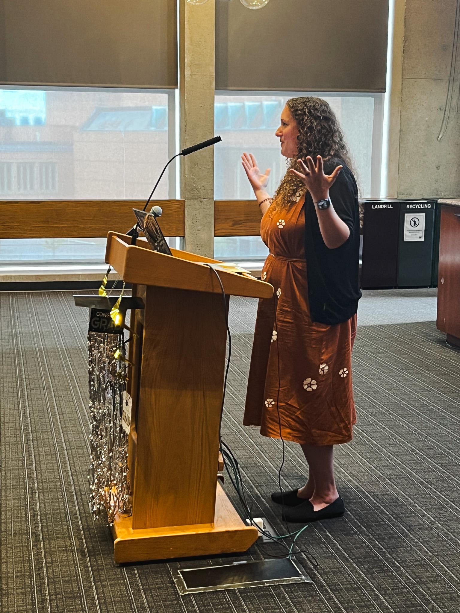 Research director Rachel speaking at spring celebration
