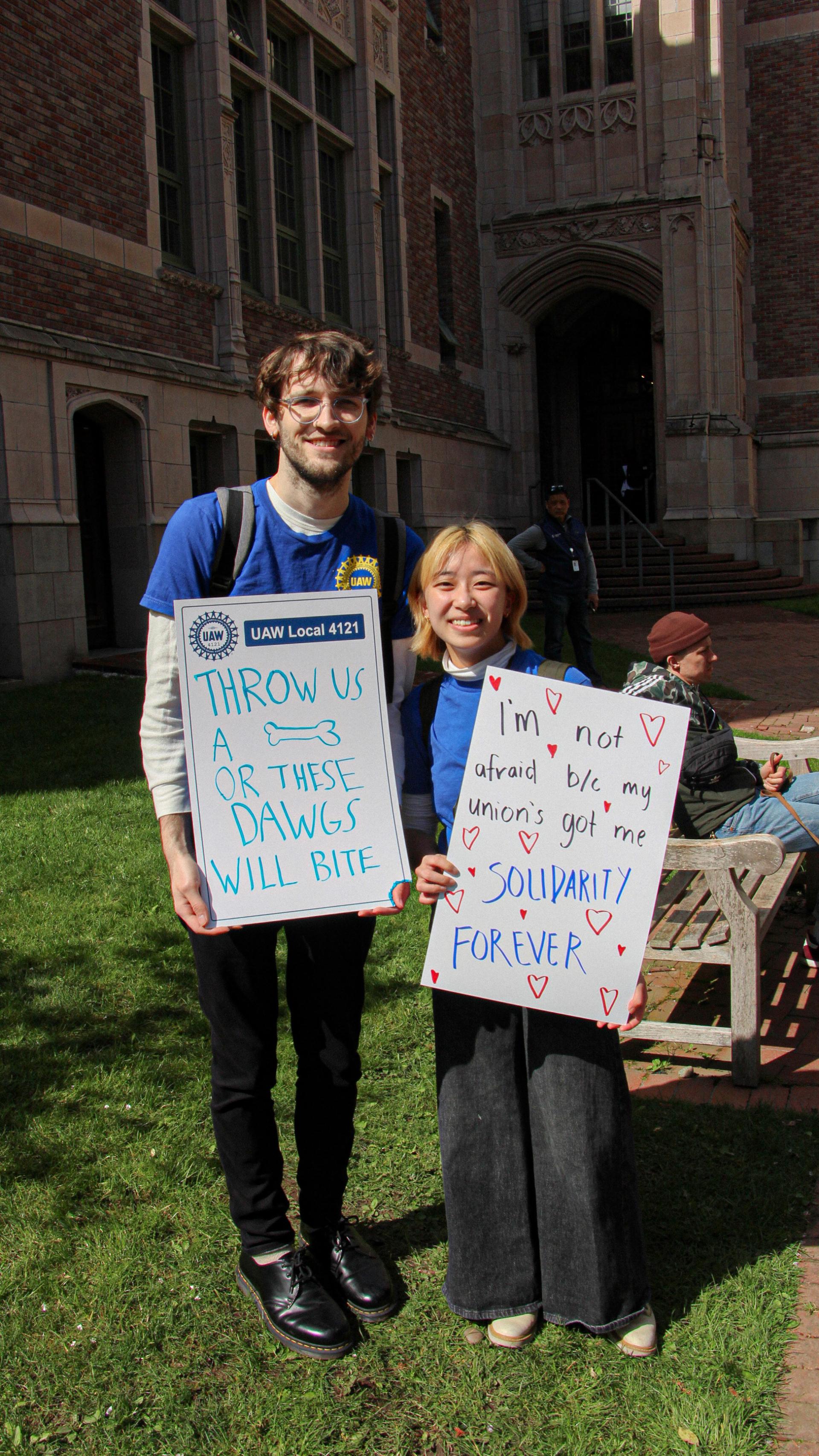 ASEs posing with signs