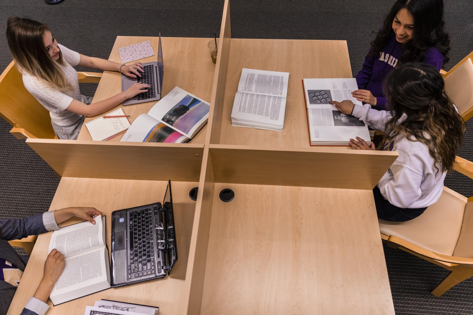 uw students in a 4 sectioned table at the library