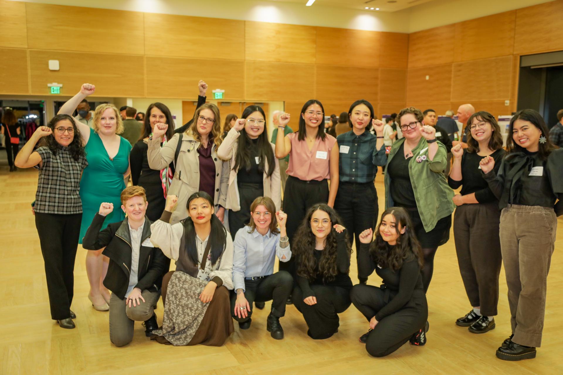 2023 Labor Studies award recipients smiling and holding up solidarity fists