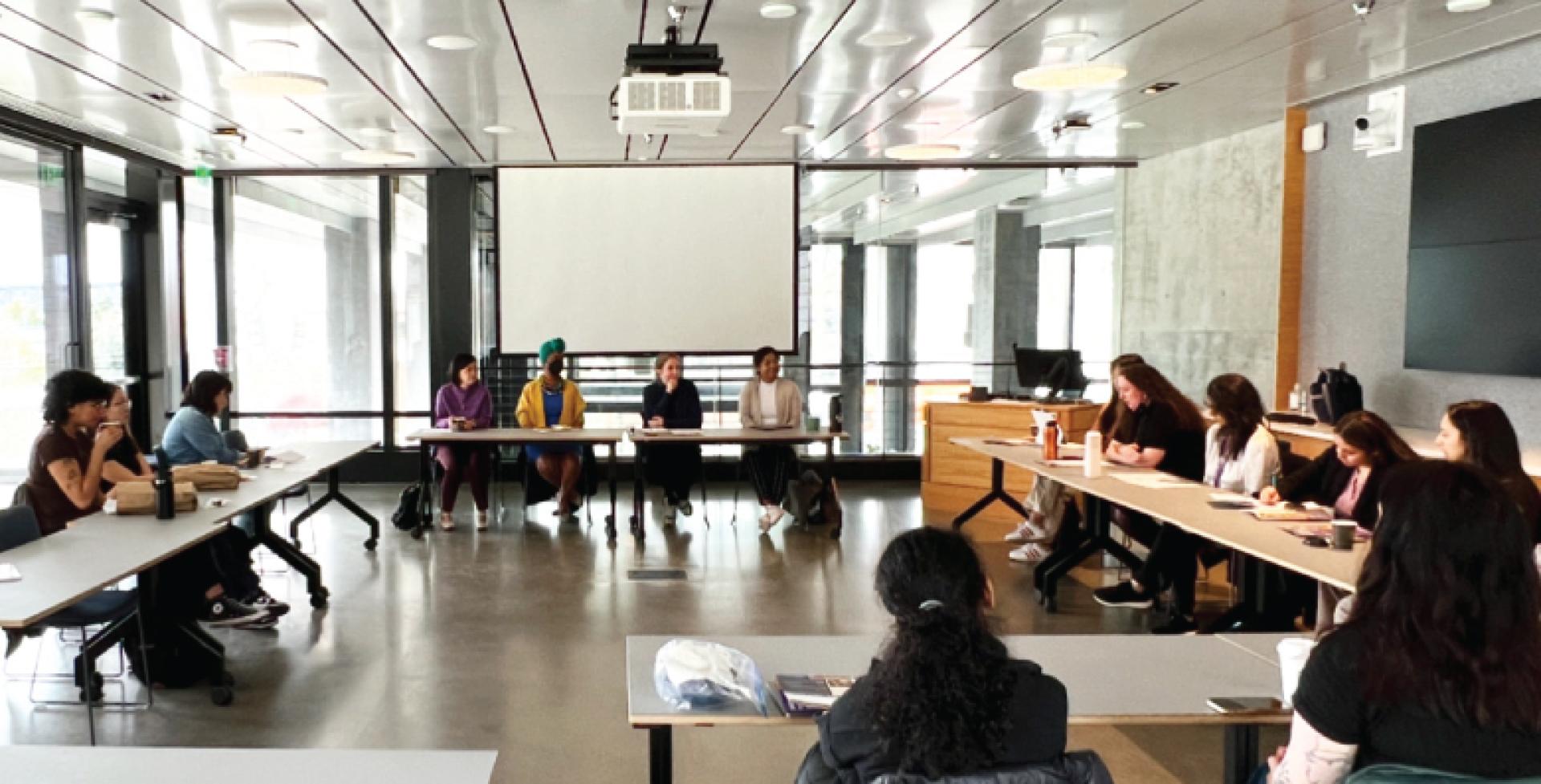 group of panelists speaking at research event